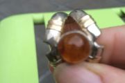 A lovely silver and gold ring with Amber stone