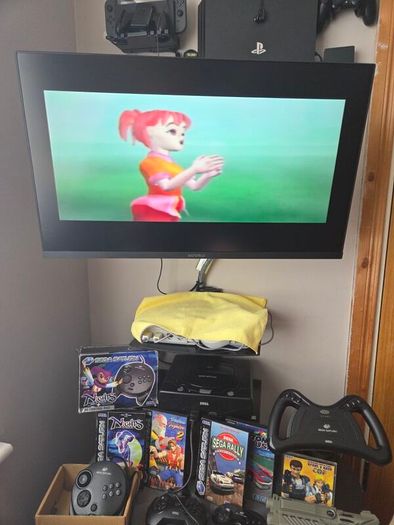 Sega Saturn w/ 3D Control Pad, Arcade Racer, Lightgun and Games