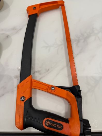 Tactix 300mm (12-inch) high-tension hacksaw with an orange and black frame