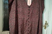 Missguided dress features a ditsy floral print on a black background with button detailing. New with Tags.
