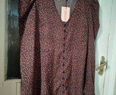 Missguided dress features a ditsy floral print on a black background with button detailing. New with Tags.