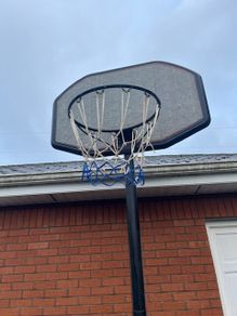 Portable Basketball Stand- Adjustable. stored in garage when not in use. In Very Good Condition.