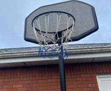 Portable Basketball Stand- Adjustable. stored in garage when not in use. In Very Good Condition.