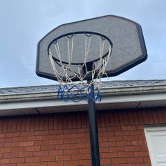 Portable Basketball Stand- Adjustable. stored in garage when not in use. In Very Good Condition.