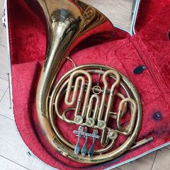 brass French horn in hard case