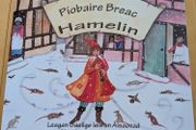 Piobaire Breac - brand new - as Gaeilge - less than half price