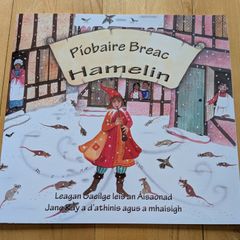 Piobaire Breac - brand new - as Gaeilge - less than half price