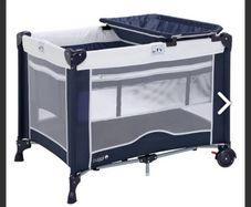 Travel cot with changer