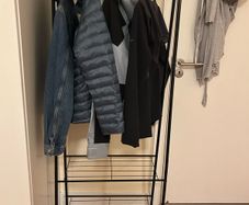 Black rack for clothes and shoes