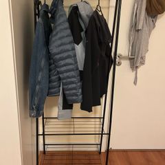 Black rack for clothes and shoes