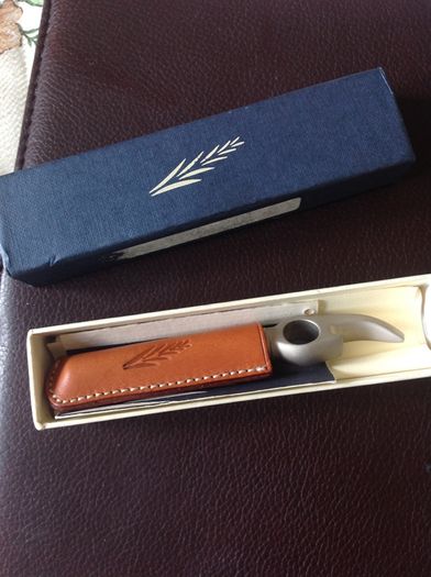 Corkscrew/ Bottle opener in Leather case.