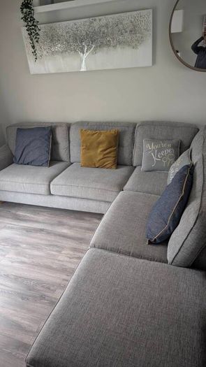 Gray fabric corner chase sofa with footstool