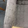 Grey quilted sofa with white metal frame Image 3
