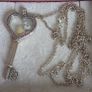 Pandora sterling silver key necklace with a heart,shaped floating locket and pink sparkling stones. Includes the two petite charms Image 8