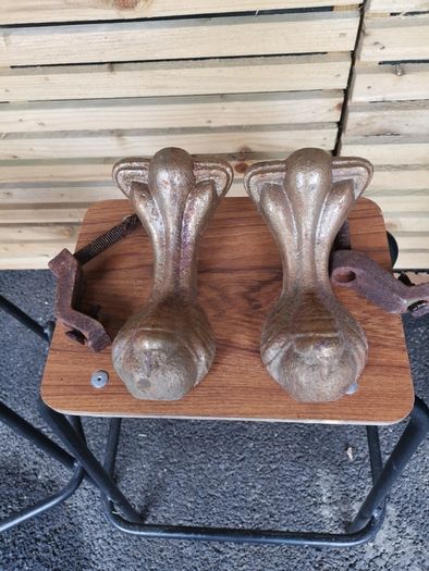 A pair of orignal cast iron bath tub claws