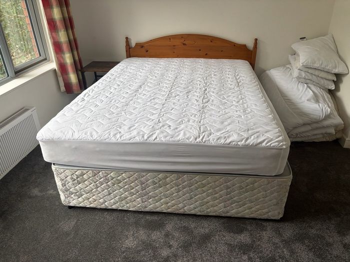 5ft Bed that splits on two. Includes the mattress and headboard.
