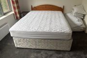 5ft Bed that splits on two. Includes the mattress and headboard.