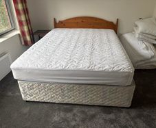 5ft Bed that splits on two. Includes the mattress and headboard.