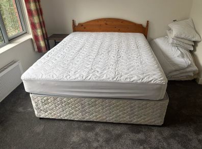 5ft Bed that splits on two. Includes the mattress and headboard.