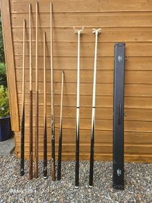Pool cues, bridge, rest and case.