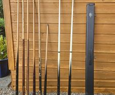 Pool cues, bridge, rest and case.
