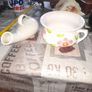 His and Hers Old Ceramic Chamber Pots hand painted floral chamber pot with side handle, together with a white glazed shaped bottle featuring scroll handle and narrow spout Image 2