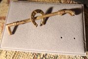 Horseshoe and Riding crop