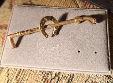 Horseshoe and Riding crop