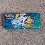 Pokemon tin and cards Image 3