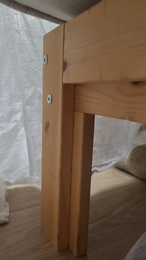 Single bed with cushioned headboard