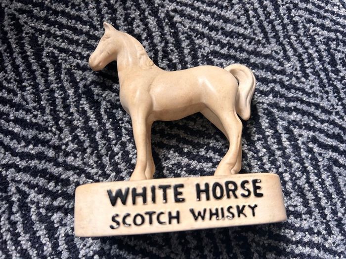 White horse counter top advertisement