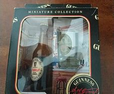 Guinness miniature bottle and glass.