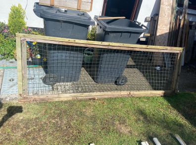 Large wooden frame with wire