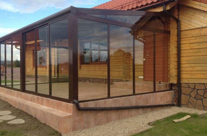 Tempered glass pergola with sliding door