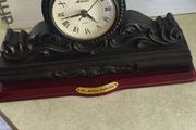 Vintage Bronze-toned Table Clock - Quartz Movement with Wooden Base by The Milano Collection in working order.