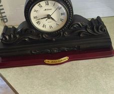 Vintage Bronze-toned Table Clock - Quartz Movement with Wooden Base by The Milano Collection in working order.