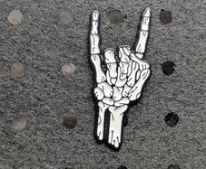 Skelton hand enamel pin