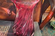 Large Heavy Mid-Century Chribska Glass-works Cranberry Art Glass Vase designed by Josef Hospodka and features a distinctive twisted silhouette with a cased glass finish