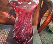 Large Heavy Mid-Century Chribska Glass-works Cranberry Art Glass Vase designed by Josef Hospodka and features a distinctive twisted silhouette with a cased glass finish