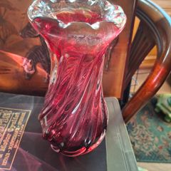 Large Heavy Mid-Century Chribska Glass-works Cranberry Art Glass Vase designed by Josef Hospodka and features a distinctive twisted silhouette with a cased glass finish