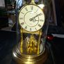 West Germany Estyma Anniversary Clock, featuring a brass finish and a rotating pendulum under a Glass Dome, Image 10