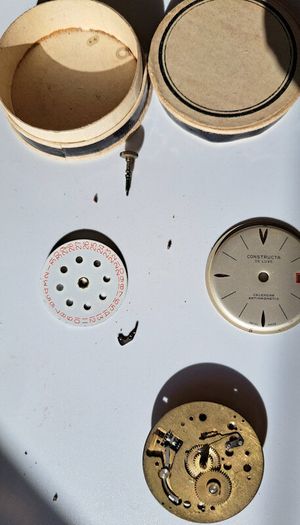 Lot of Antique Watch Parts in Containers