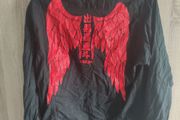 Black shirt with wings print fits size medium