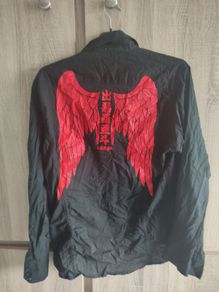 Black shirt with wings print fits size medium