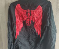 Black shirt with wings print fits size medium