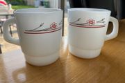 A Pair of Termocrisa Milk Glass Mugs