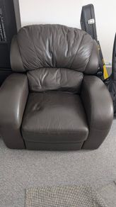Leather Armchair with minor cosmetic damage.