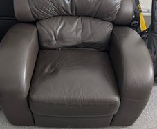Leather Armchair with minor cosmetic damage.