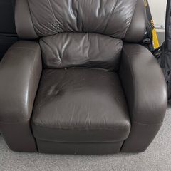 Leather Armchair with minor cosmetic damage.