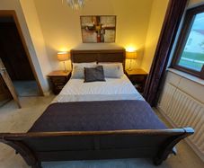 Beautiful Queen Sized solid sleigh mahogany bed